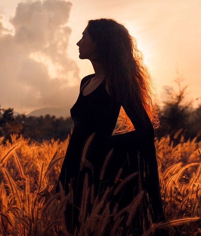 beautiful woman silhouette on sunset